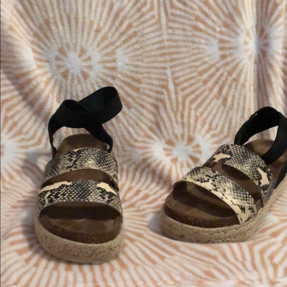 Black and snakeskin platforms